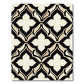 Sophisticated Black and Beige Quatrefoil Rug